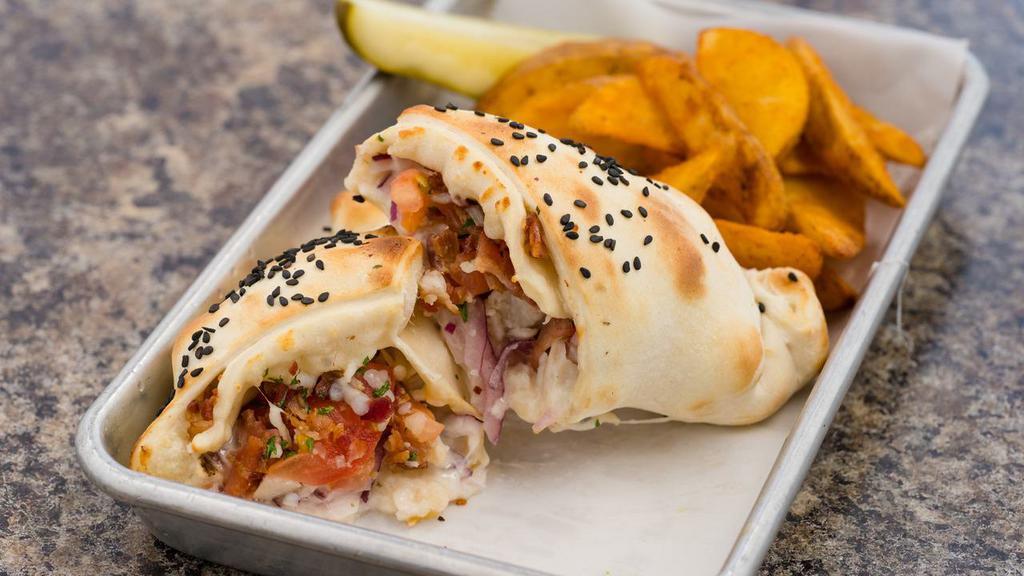 Chicken Bacon Ranch Hot Hat · Grilled chicken breast marinated in red wine vinegar, smoky bacon, diced red onion, tomato, cheese and ranch dressing stuffed into our pizza dough shell.
