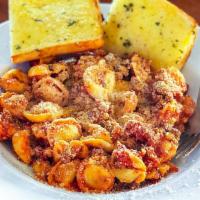 Cheesy Tortellini · Choose tortellini with your choice of chicken, Italian sausage, or ground beef, mixed with y...