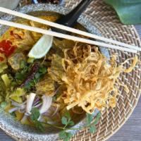 Khao Soi · Northern-style curry broth balancing between yellow curry paste and red curry paste, egg noo...