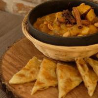 Mussamun Beef Roti · Beef brisket slow-cooked in special Mussamun curry, potato, peanut and onion served with hom...