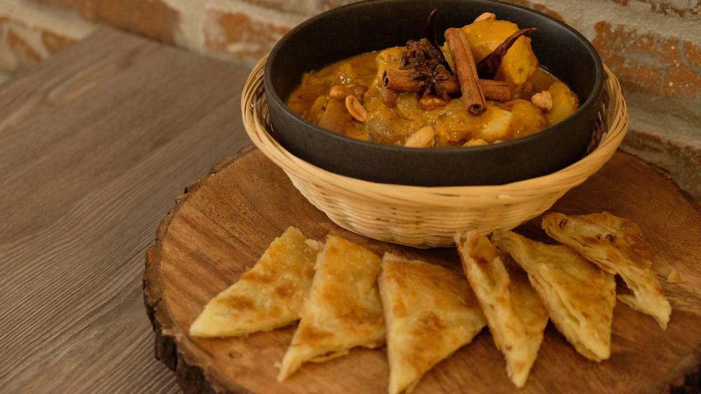 Mussamun Beef Roti · Beef brisket slow-cooked in special Mussamun curry, potato, peanut and onion served with homemade Roti bread.