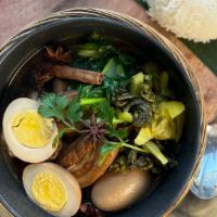 Mhoo PaLo · Pork belly and egg slow-cooked over five hours in Thai spice “Palo” style served with Chines...