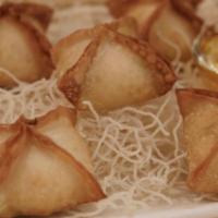 Crab Rangoon  · Crispy wonton filled with Crab meat blended with cream cheese, green onion and water chestnu...