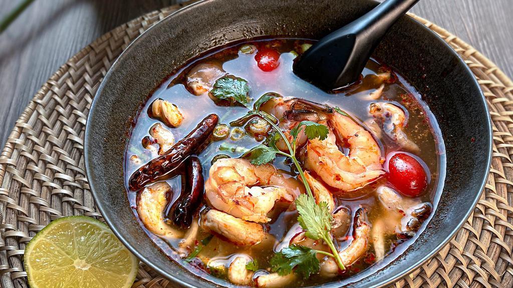Tom Yum  · Lemongrass, galangal, kaffir lime leaves, cilantro, oyster mushrooms, cherry tomatoes, green onions and onions in a hot and sour broth.
