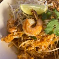 Pad Thai · Wok-fried thin rice noodles with tofu, eggs, bean sprouts, chives, shallots, and crushed pea...