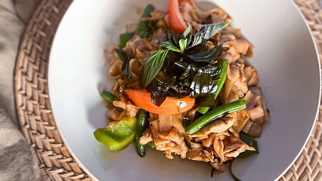 Drunken Noodle · Medium spicy!!. Wok-fried flat rice noodles with garlic, green beans, bell peppers, tomatoes, chili, onions, and basil. (Pad Kee Mao)