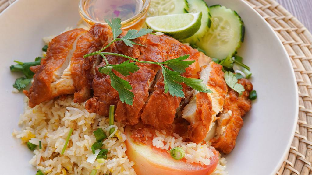 Crispy Chicken Fried Rice  · Fried battered chicken breast, egg, tomato, onion, cilantro, served with sweet chili sauce.