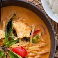 Red Curry  · Red coconut curry with bamboo, green bean, bell peppers, and basil. (Served with rice)