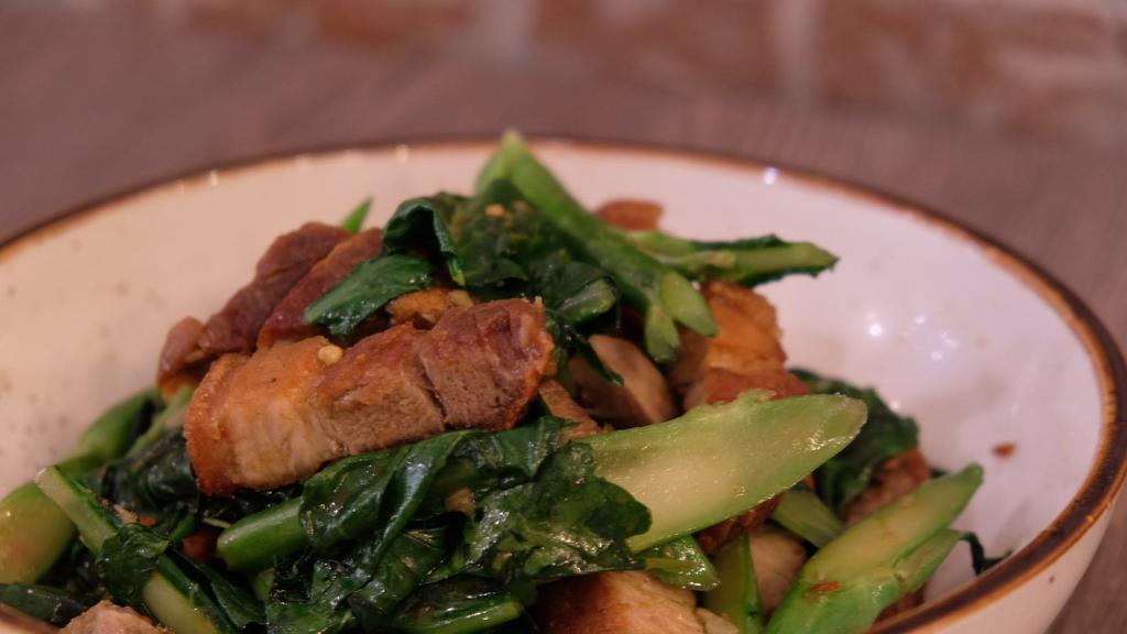 Kana Moo Krob · Stir-fried Chinese broccoli with crispy pork belly, garlic oyster sauce, and fresh chili.