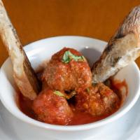 Polpette · Homemade meatballs served with toasted bread.