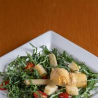 Arthichokes Salad · 2 marinated Artichokes with arucola and parmigiano cheese, in lemon dressing