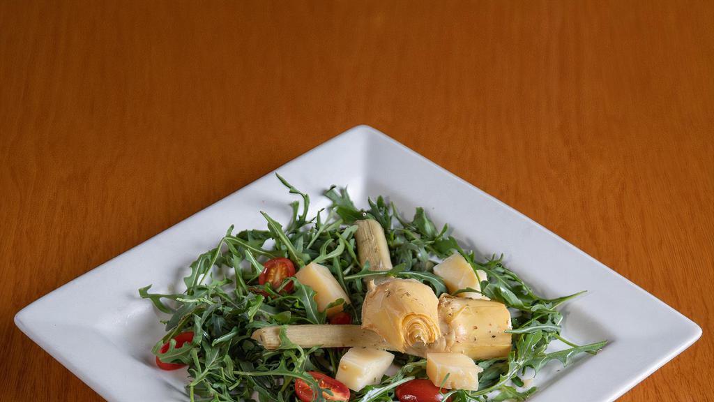 Arthichokes Salad · 2 marinated Artichokes with arucola and parmigiano cheese, in lemon dressing