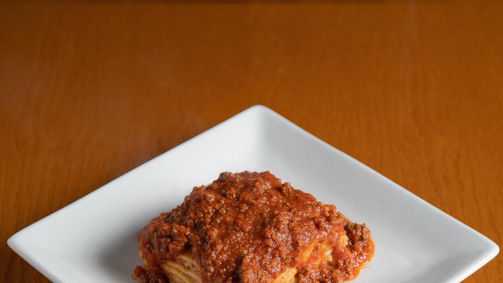 Lasagna · Mamma Francesca’s famous traditional lasagna meat sauce.