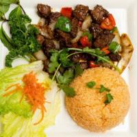 S37. Shaken Beef with  Rice / Bò Lúc Lắc · Cubed filet mignon sautéed in onion and pepper sauce.