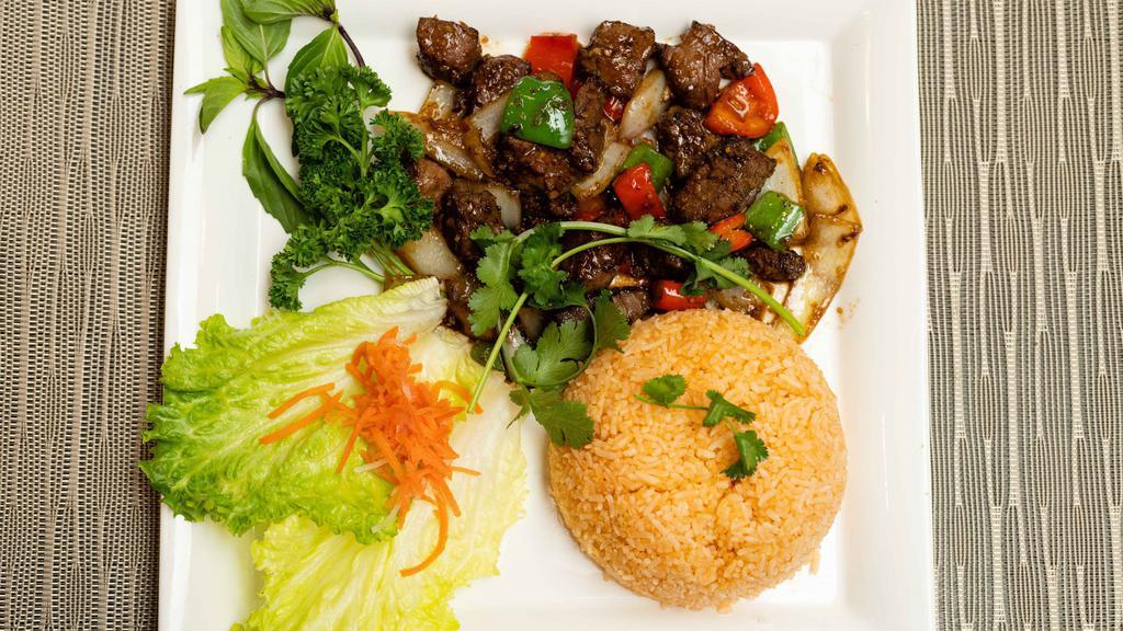 S37. Shaken Beef with  Rice / Bò Lúc Lắc · Cubed filet mignon sautéed in onion and pepper sauce.
