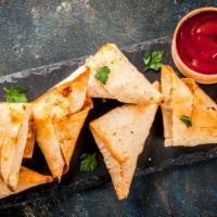 Samosa · Fresh and crispy triangle shaped pastry filled with potatoes, onions, spices, and chef's spe...