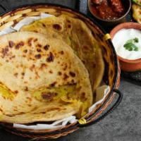 Paratha · Chef's mother's recipe. made by hand on demand. multi-layer flaky bread with choice of sauce.