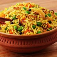 Vegetable Biryani · Biryani rice comes with green peas, carrot, cashews, raisin, and fried onion on top. vegetar...