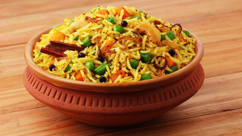 Vegetable Biryani · Biryani rice comes with green peas, carrot, cashews, raisin, and fried onion on top. vegetarian.