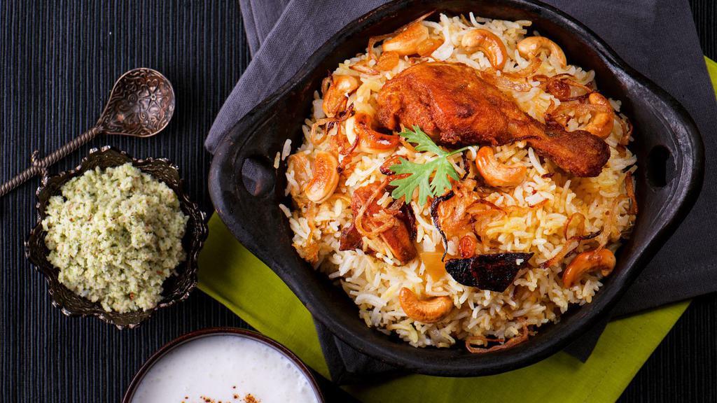 Chicken Biryani · Biryani rice comes with house special chicken curry, cashews, raisin and fried onion on top.