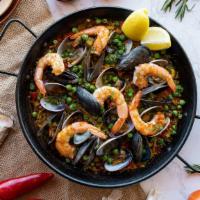 Paella Marinera · gulf prawns, manilla clams, mussels, calamari, clams, peas,  onion-tomato sofrito, saffron, ...