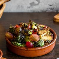 Bruselas · crispy brussels sprouts, grapes, balsamic reduction