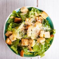 The Caesar Salad · Fresh, crisp romaine lettuce, toasted herb croutons, shaved Parmesan cheese and creamy Caesa...