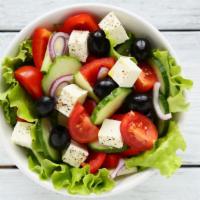 The Greek Salad · Crisp romaine hearts, fresh cucumbers, tomatoes and red onions with tang feta cheese, Kalama...
