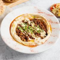 Hummus Bowl with Moroccan Beef (GF) · Hummus topped with Moroccan spiced ground beef and pine nuts. Served with 2 pita. Contains t...