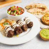 Beef Skewer Plate · All natural ground beef and lamb with blended spices and garlic. Served with tahini, 1 pita,...