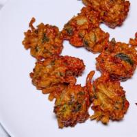 A03. Vegetable Pakora · Onion, potatoes, mixed Vegetables coated in spicy lentil batter and fried.