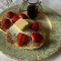 Strawberry Pancakes · Two large strawberry buttermilk pancakes, with butter and syrup. PANCAKE ADD ONS
