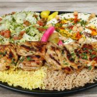 House Special · Boneless grilled chicken thigh over seasoned rice, served with house salad, hummus and pita ...