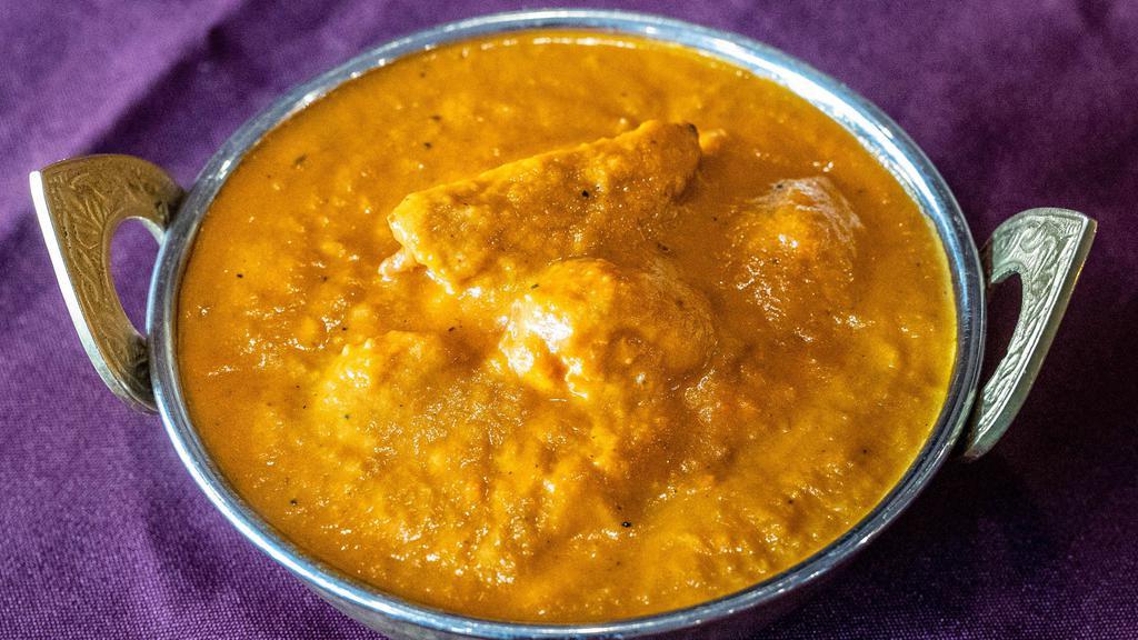Chicken Tikka Masala · Boneless white meat cubes barbecued in a clay oven and cooked with tikka masala sauce.