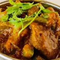 Chicken Vindaloo · Chicken and potatoes cooked with spicy vindaloo sauce.