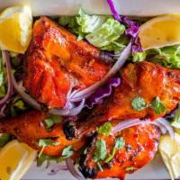 Chicken Tandoori · Two chicken legs marinated and cooked in a clay oven.