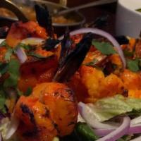 Prawn Tandoori · Shrimp marinated and cooked in a clay oven.