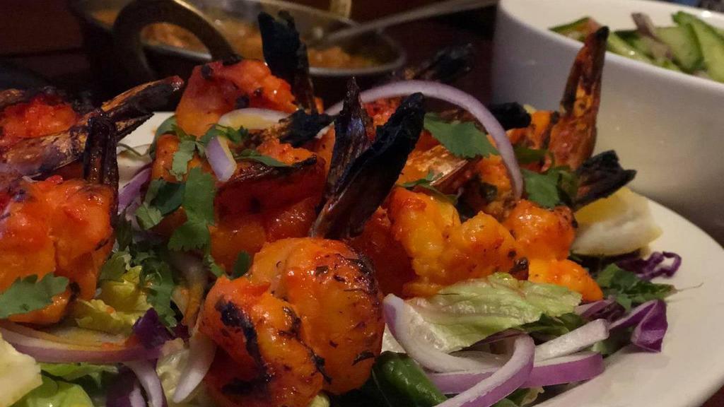 Prawn Tandoori · Shrimp marinated and cooked in a clay oven.