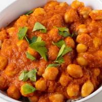 Chana Massala · Chickpeas cooked with onion and tomato gravy with herbs and spices.