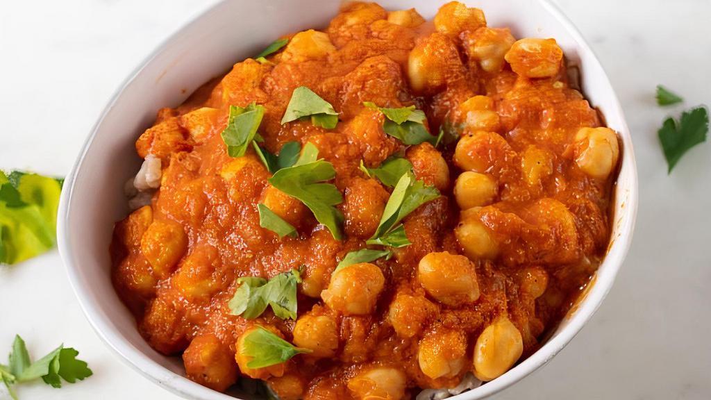 Chana Massala · Chickpeas cooked with onion and tomato gravy with herbs and spices.