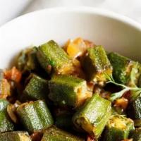 Bhindi Massala · Fresh okra cooked with onion, tomatoes, and spices.