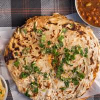 Amritsari Kulcha · Round Indian bread made with all purpose flour stuffed with onions, potatoes made in clay ov...