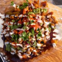 Samosa Chaat · Samosas savory fried pastries filled with spicy potatoes and peas, and topped with chopped o...