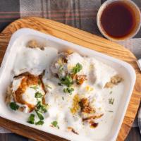 Dhai Bhalla · Moong lentil deep fried dumpling topped with yogurt potatoes red and mint chutney with spices.
