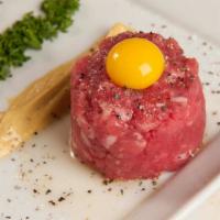 Steak Tartare · Parsley, capers, cornichons, dijon, red onion, lemon zest and quail egg.