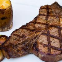 Porterhouse · Recognized as the most preferred cut of beef - dry aged in house. Served with twice baked po...