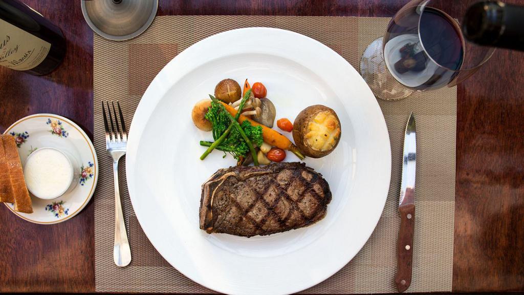 Third Ave Club Steak · 16 oz bone-in new York strip - dry aged in house and brandy peppercorn sauce. Served with twice baked potato & seasonal vegetables.