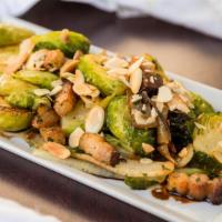 Brussel Sprouts & Bacon · Onions, rosemary, EVOO and almonds.
