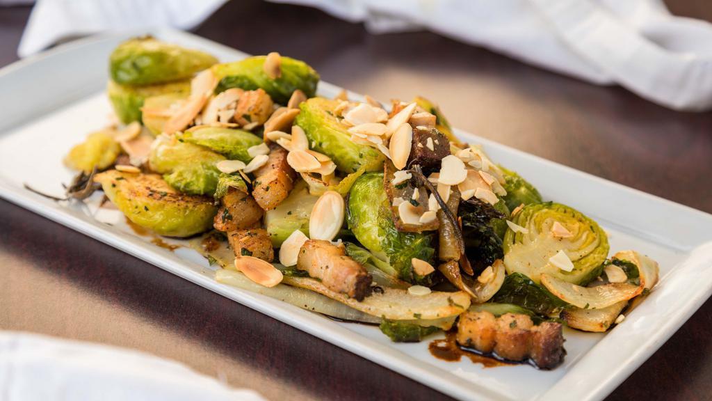 Brussel Sprouts & Bacon · Onions, rosemary, EVOO and almonds.