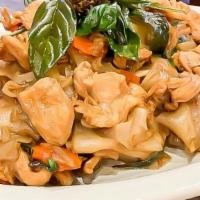 Drunken Noodles · Stir fried wide rice noodles with bell peppers, carrots, tomato, basil